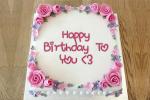 Write a greeting on the birthday cake roses