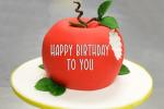Write a greeting on the apple birthday cake