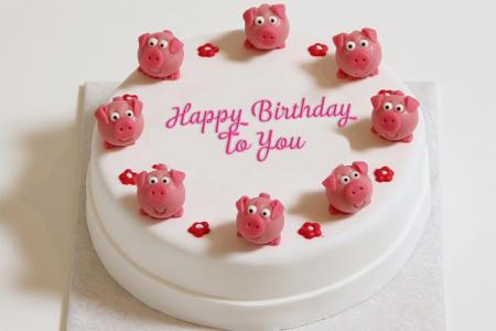 Write text  on birthday cake with funny pigs